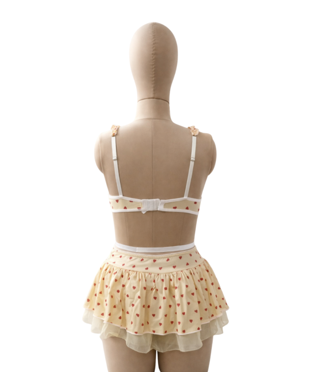 pastel-yellow-heart-print-bralette-ruffle-skirt-lingerie-set-back-mannequin