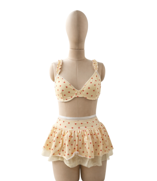 pastel-yellow-heart-print-bralette-ruffle-skirt-lingerie-set-front-mannequin